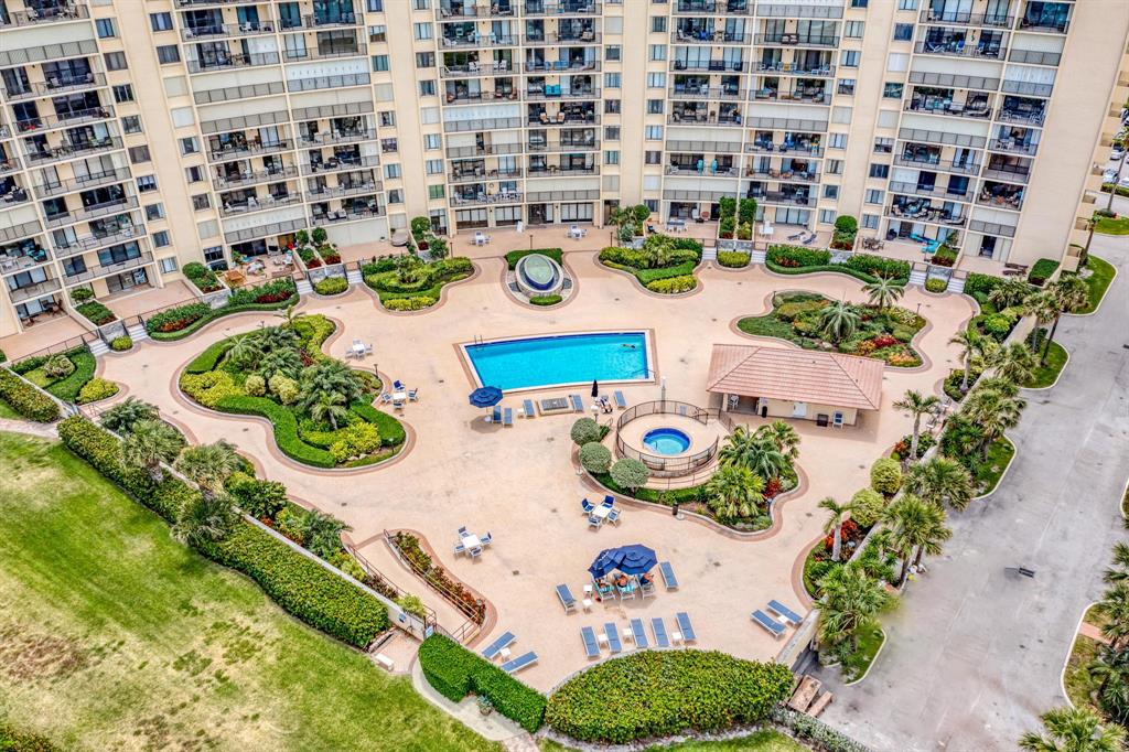300 Ocean Trail Way, Unit 907 Jupiter, FL 33477 - Photo 4 of 42 view of a dining table with many potted plants