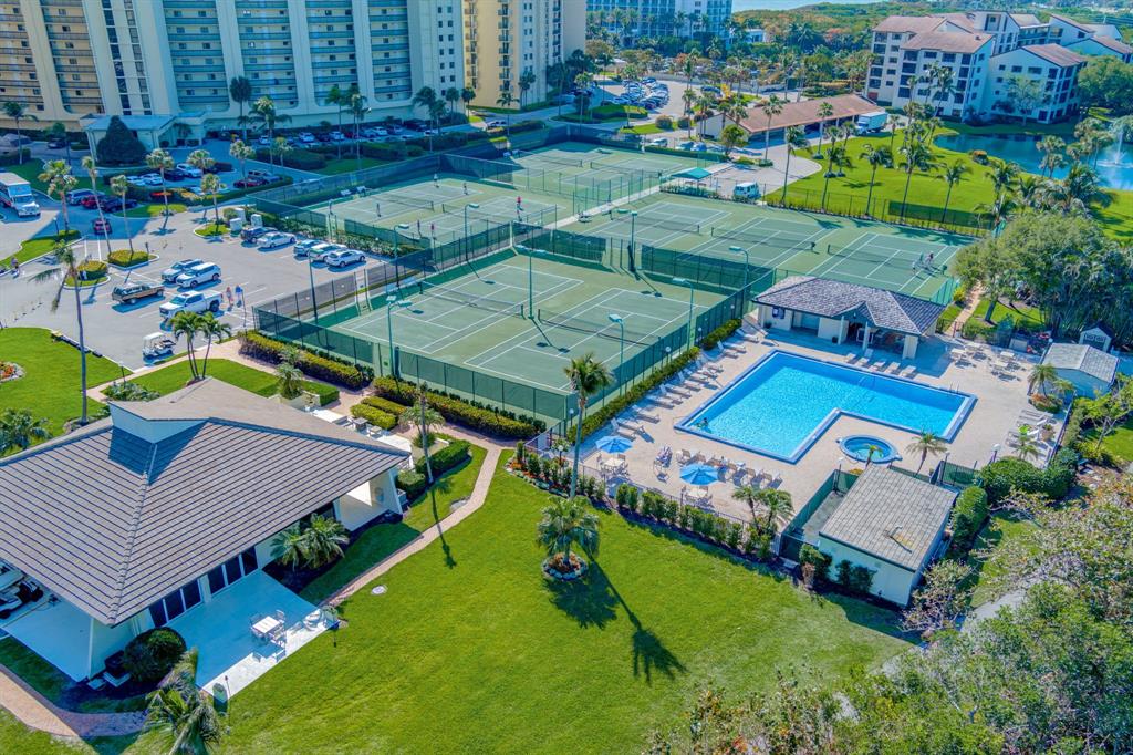 300 Ocean Trail Way, Unit 907 Jupiter, FL 33477 - Photo 5 of 42 an aerial view of a house with a garden and swimming pool