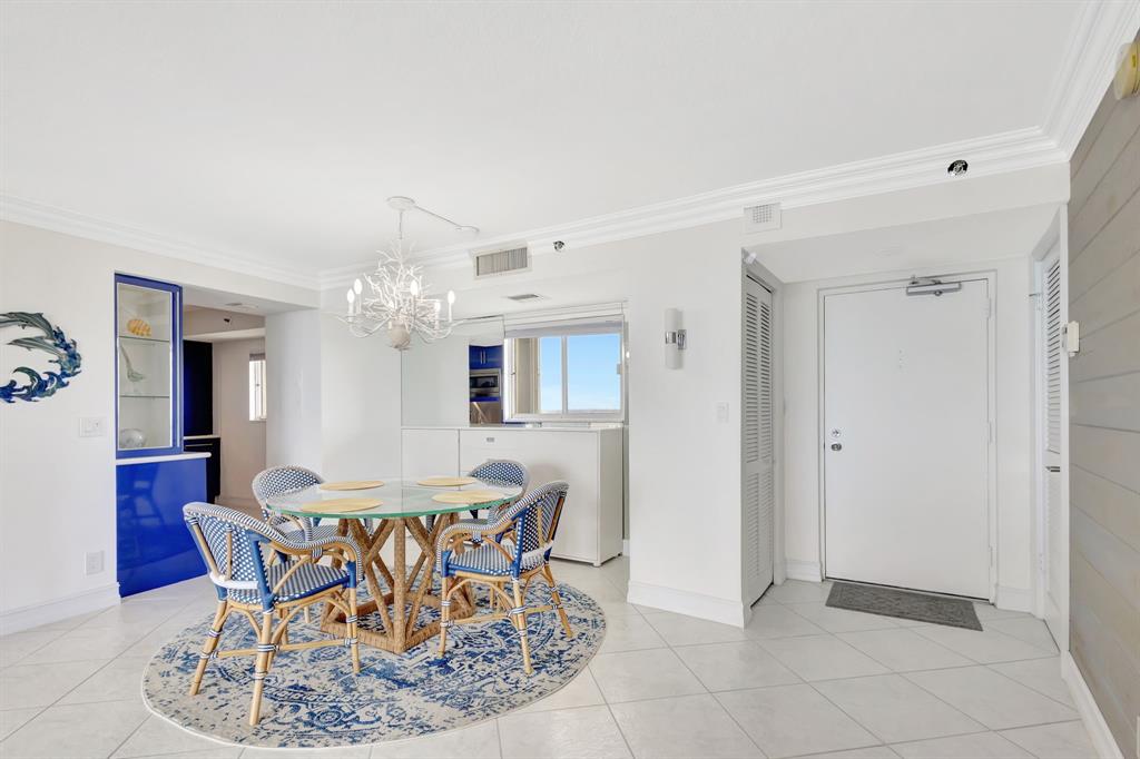 300 Ocean Trail Way, Unit 907 Jupiter, FL 33477 - Photo 8 of 42 a view of a dining room with furniture