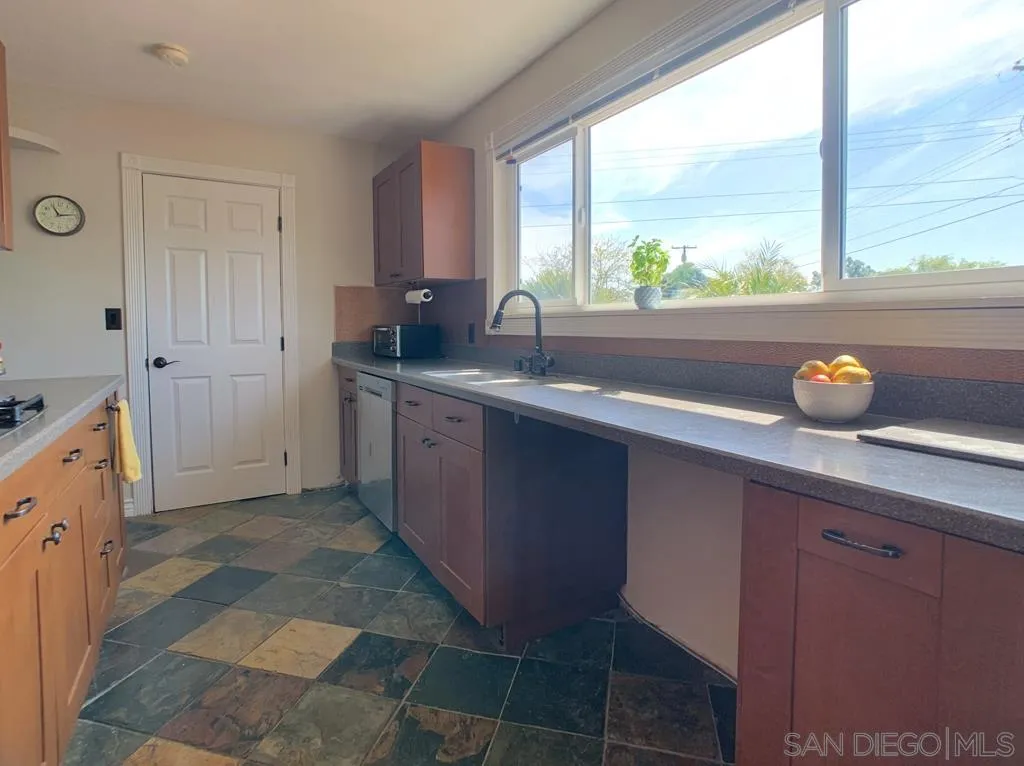 14416 Springvale Street Poway, CA 92064 - Photo 4 of 18 a kitchen with a sink and a window