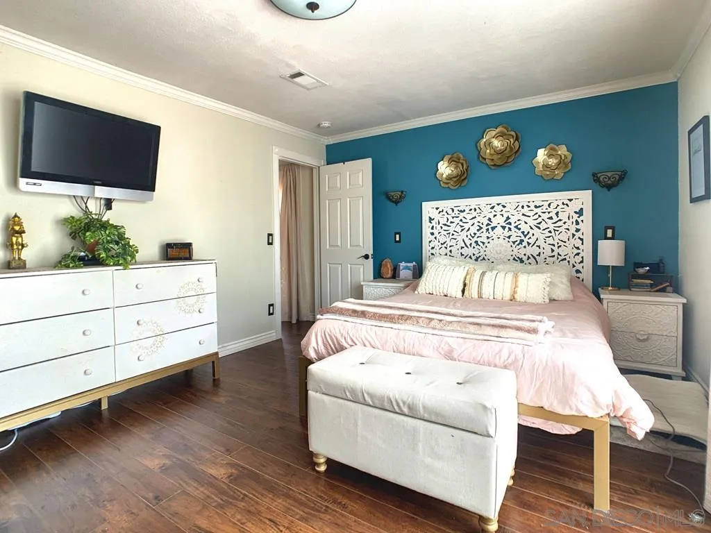 14416 Springvale Street Poway, CA 92064 - Photo 10 of 18 a bedroom with a bed and a flat screen tv
