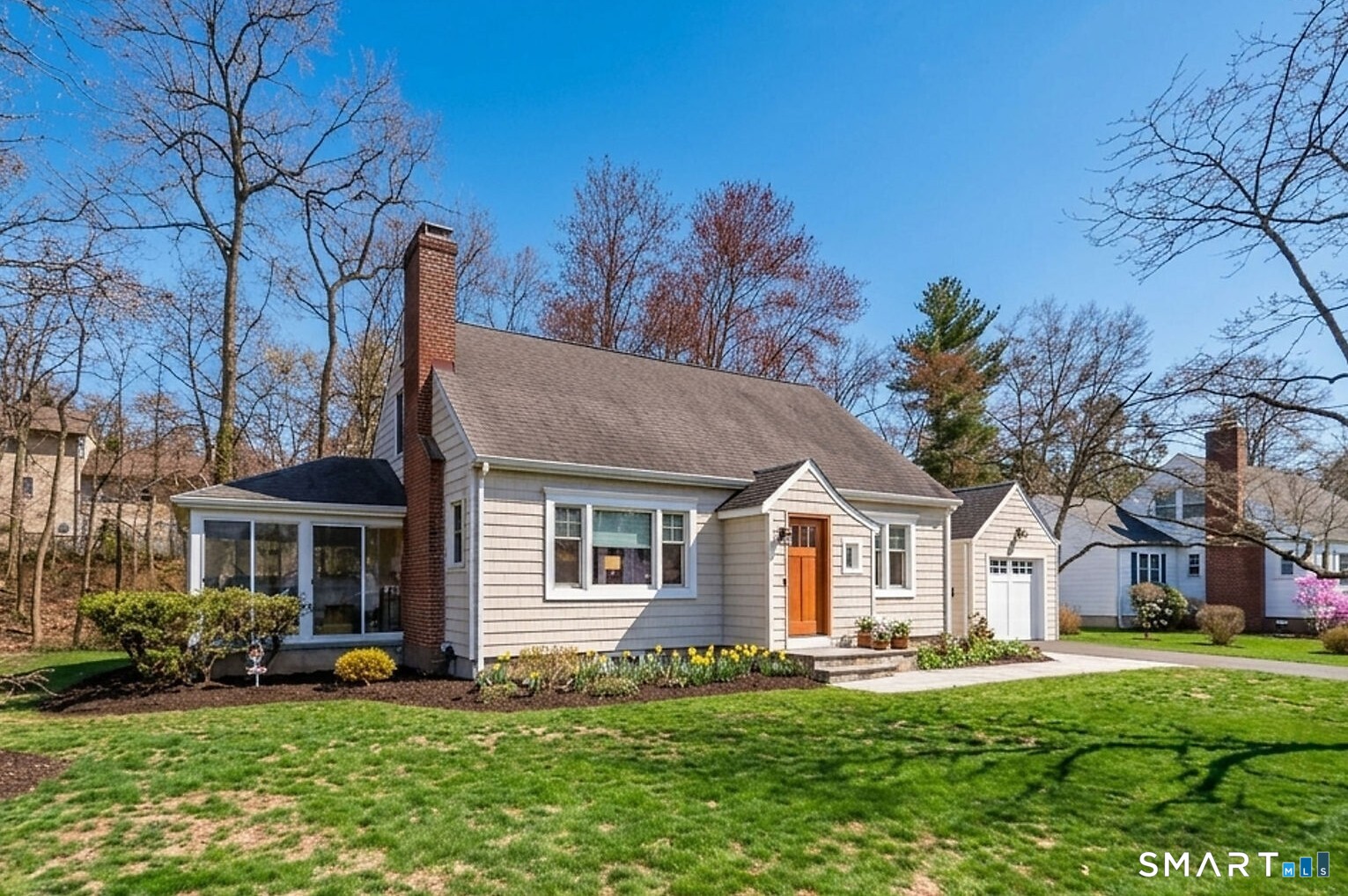 59 Forest Hill Road North Haven, CT 06473 - Photo 2 of 35 a front view of a house with a garden