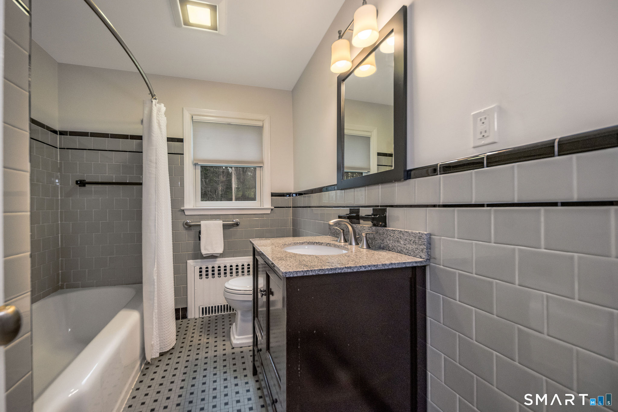 59 Forest Hill Road North Haven, CT 06473 - Photo 22 of 35 a bathroom with a sink a toilet and shower