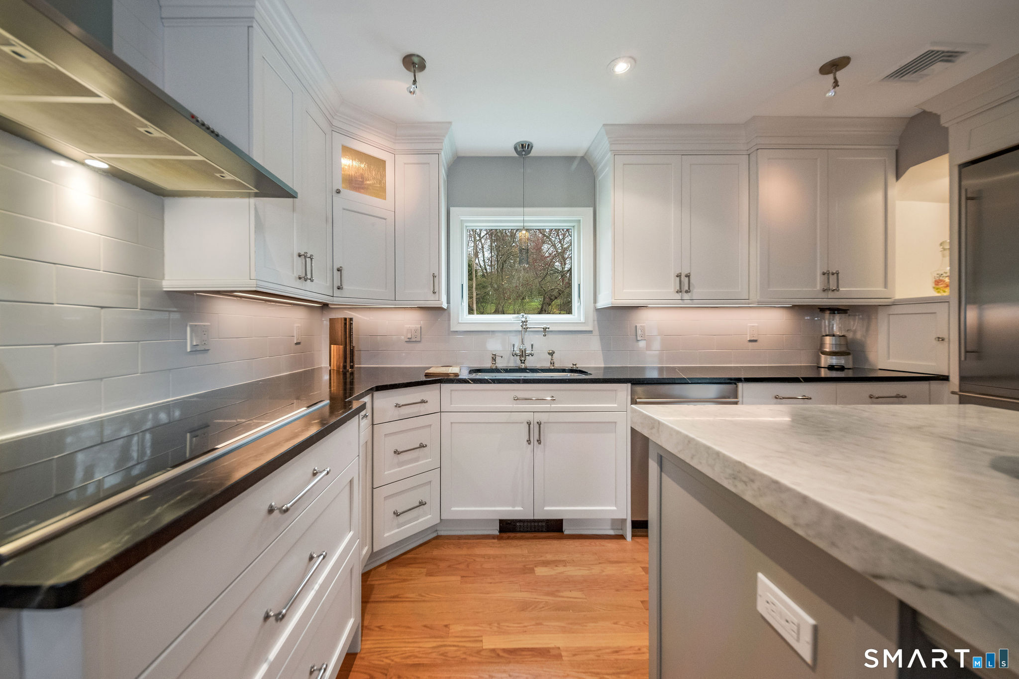 59 Forest Hill Road North Haven, CT 06473 - Photo 6 of 35 a kitchen with stainless steel appliances granite countertop a sink stove and cabinets