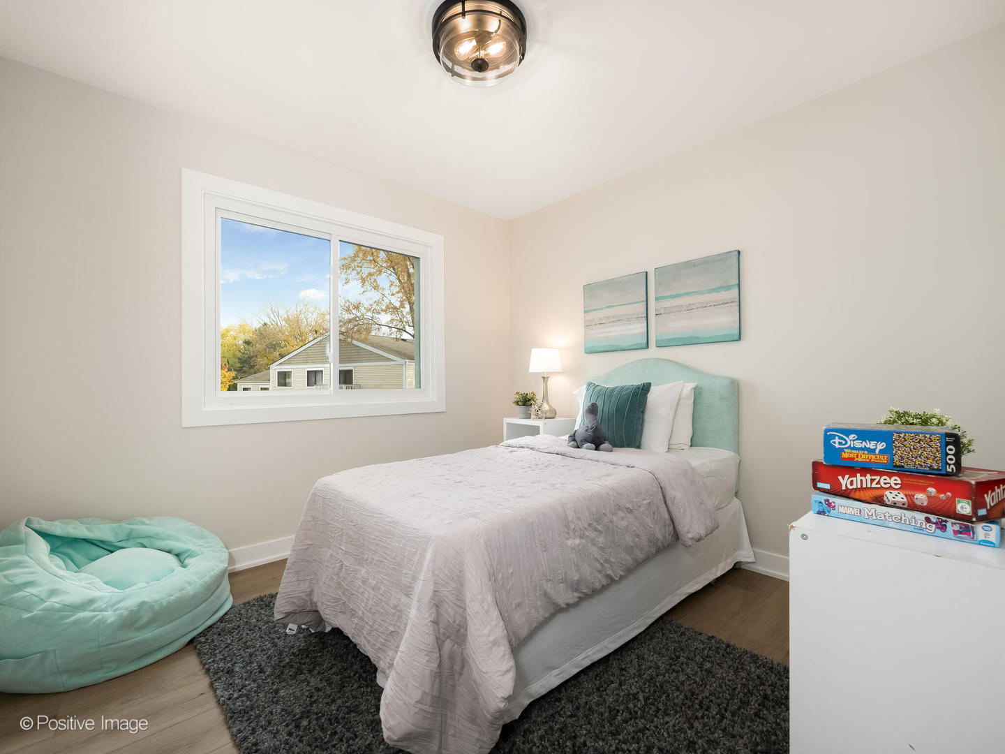 823 Cambridge Place, Unit 823 Wheeling, IL 60090 - Photo 11 of 16 a bedroom with a bed and a couch