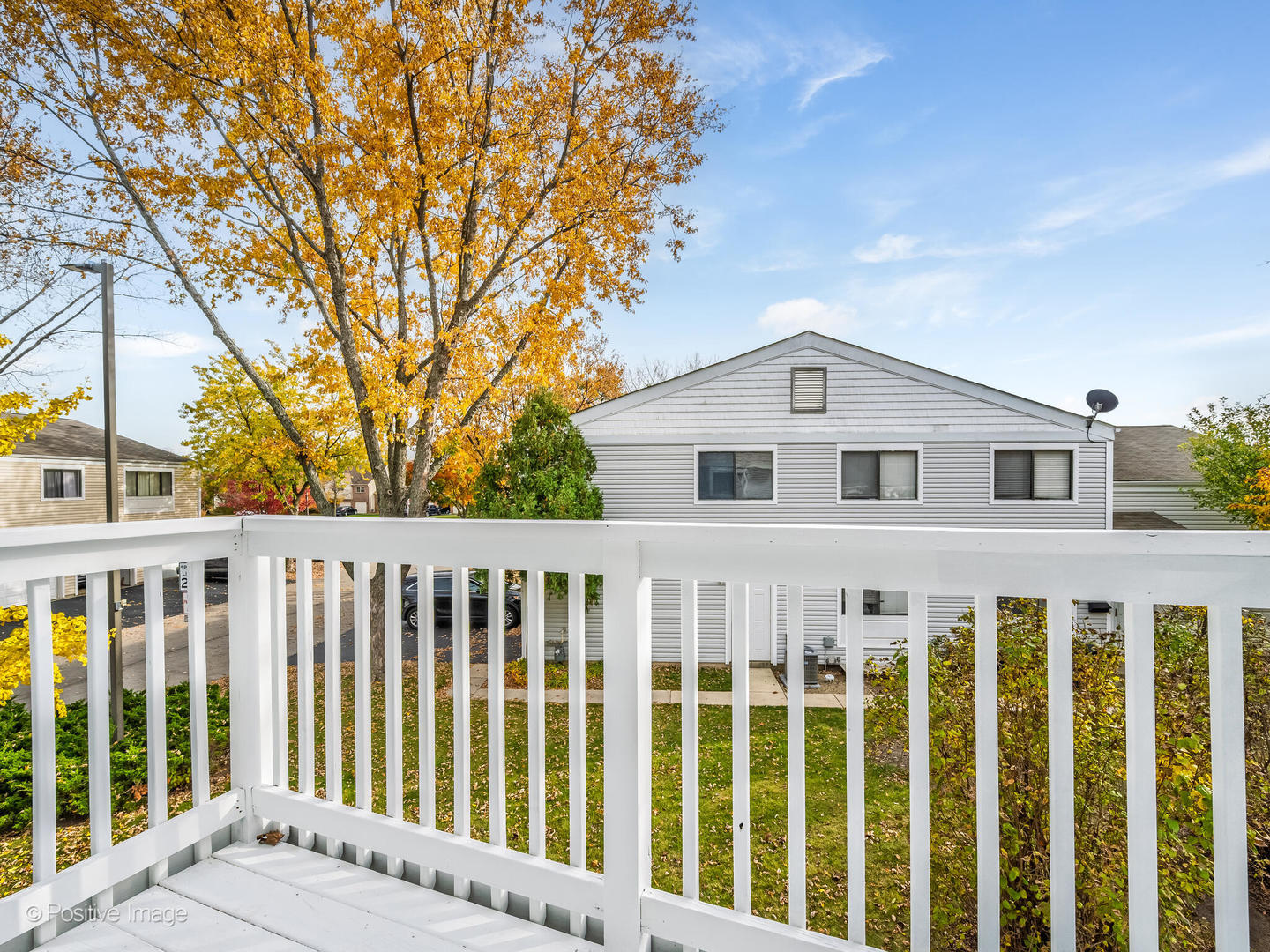 823 Cambridge Place, Unit 823 Wheeling, IL 60090 - Photo 16 of 16 a view of a white house with a large window