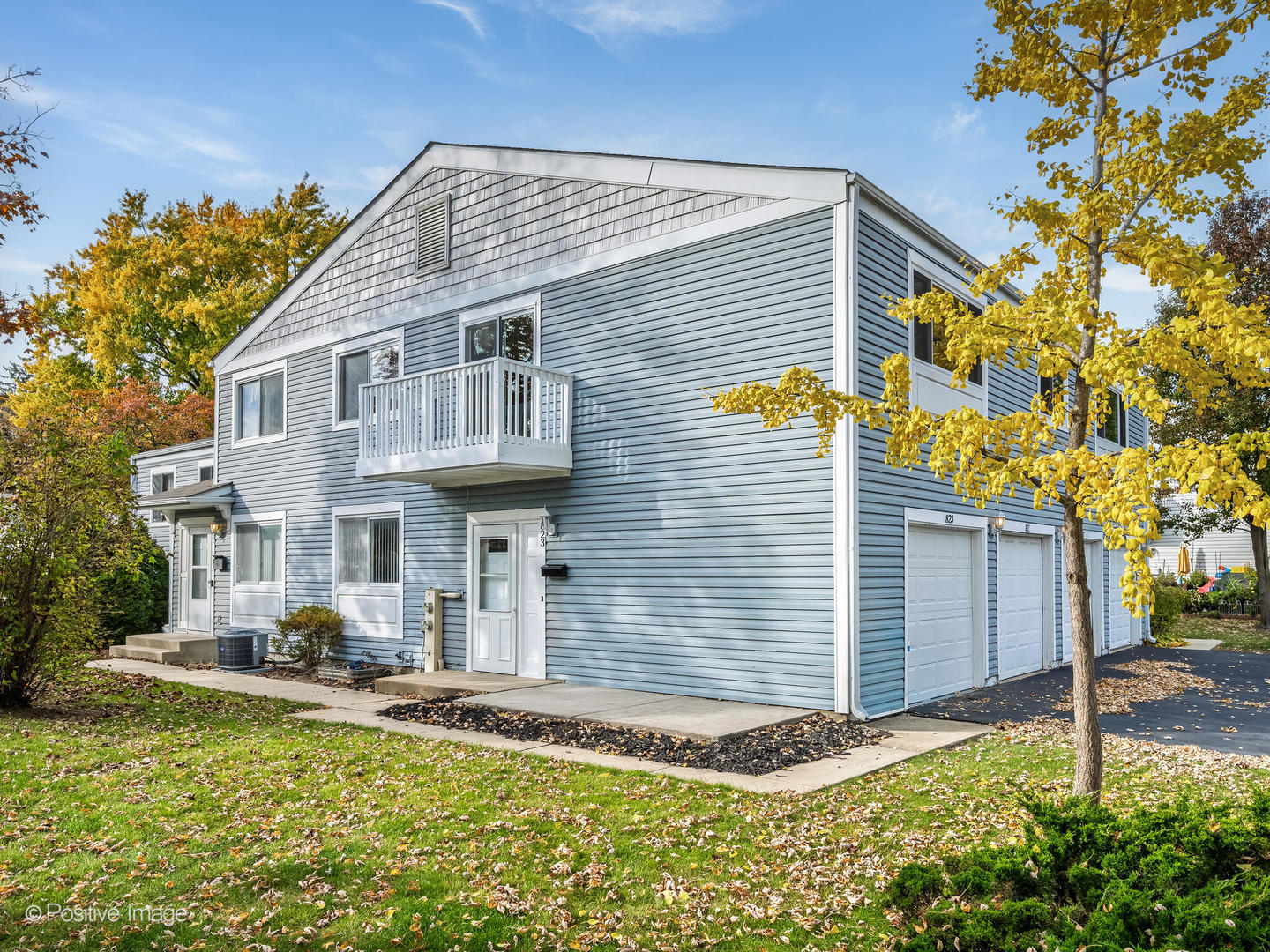 823 Cambridge Place, Unit 823 Wheeling, IL 60090 - Photo 2 of 16 a front view of a house with garden