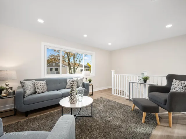 a living room with furniture and a table