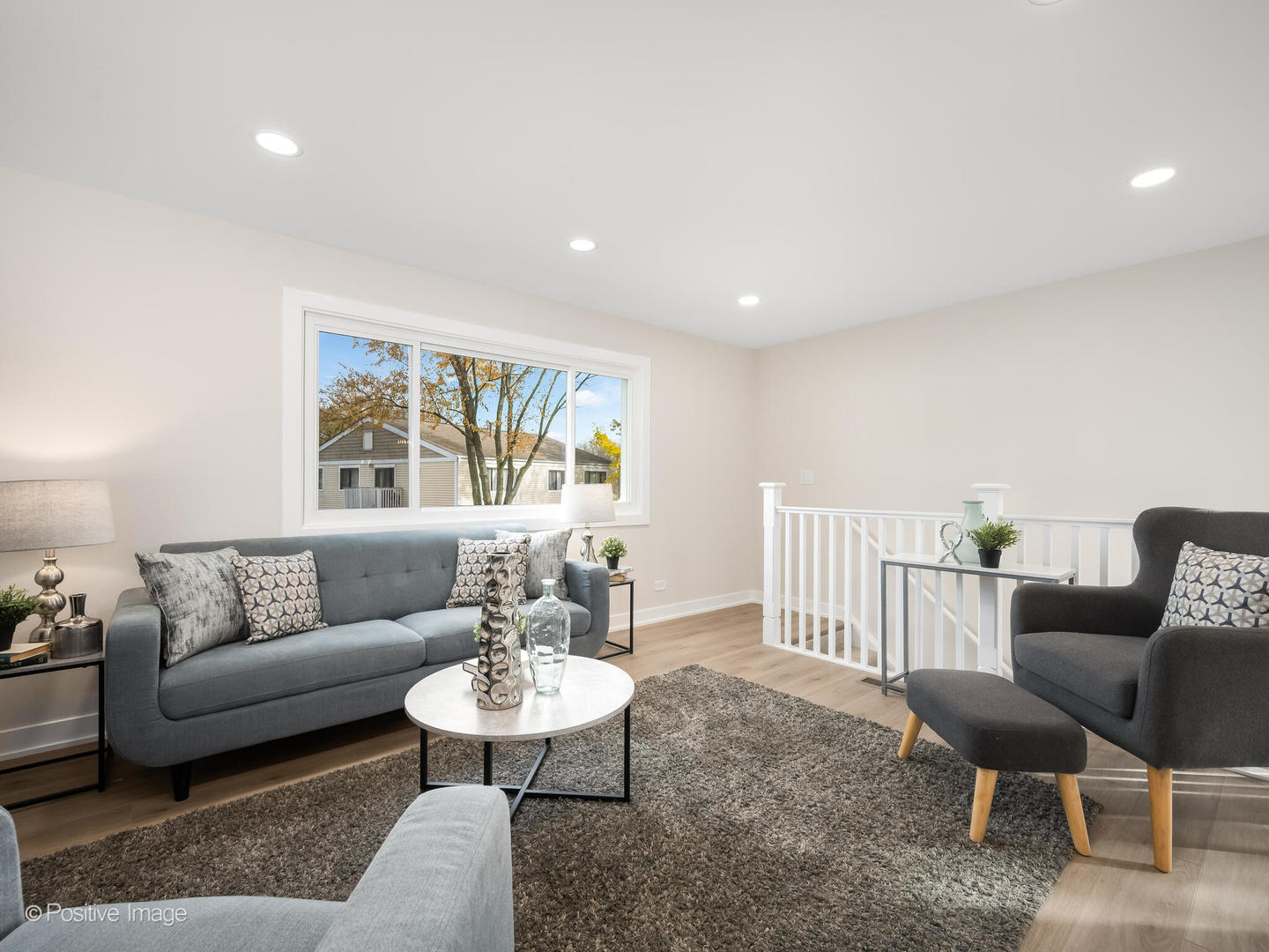 823 Cambridge Place, Unit 823 Wheeling, IL 60090 - Photo 4 of 16 a living room with furniture and a table