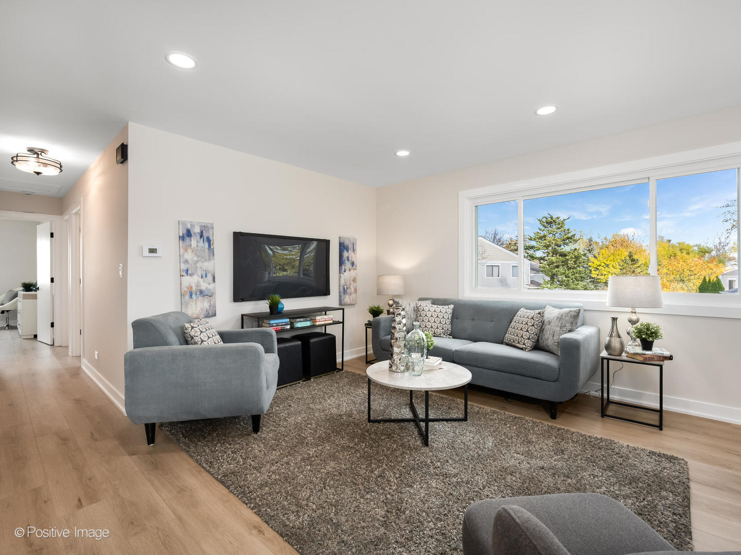 823 Cambridge Place, Unit 823 Wheeling, IL 60090 - Photo 5 of 16 a living room with furniture and a flat screen tv
