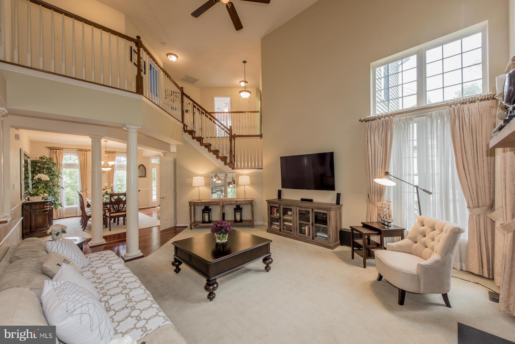 6013 Sandy Ridge Elkridge, MD 21075 - Photo 2 of 30 a living room with furniture and a flat screen tv
