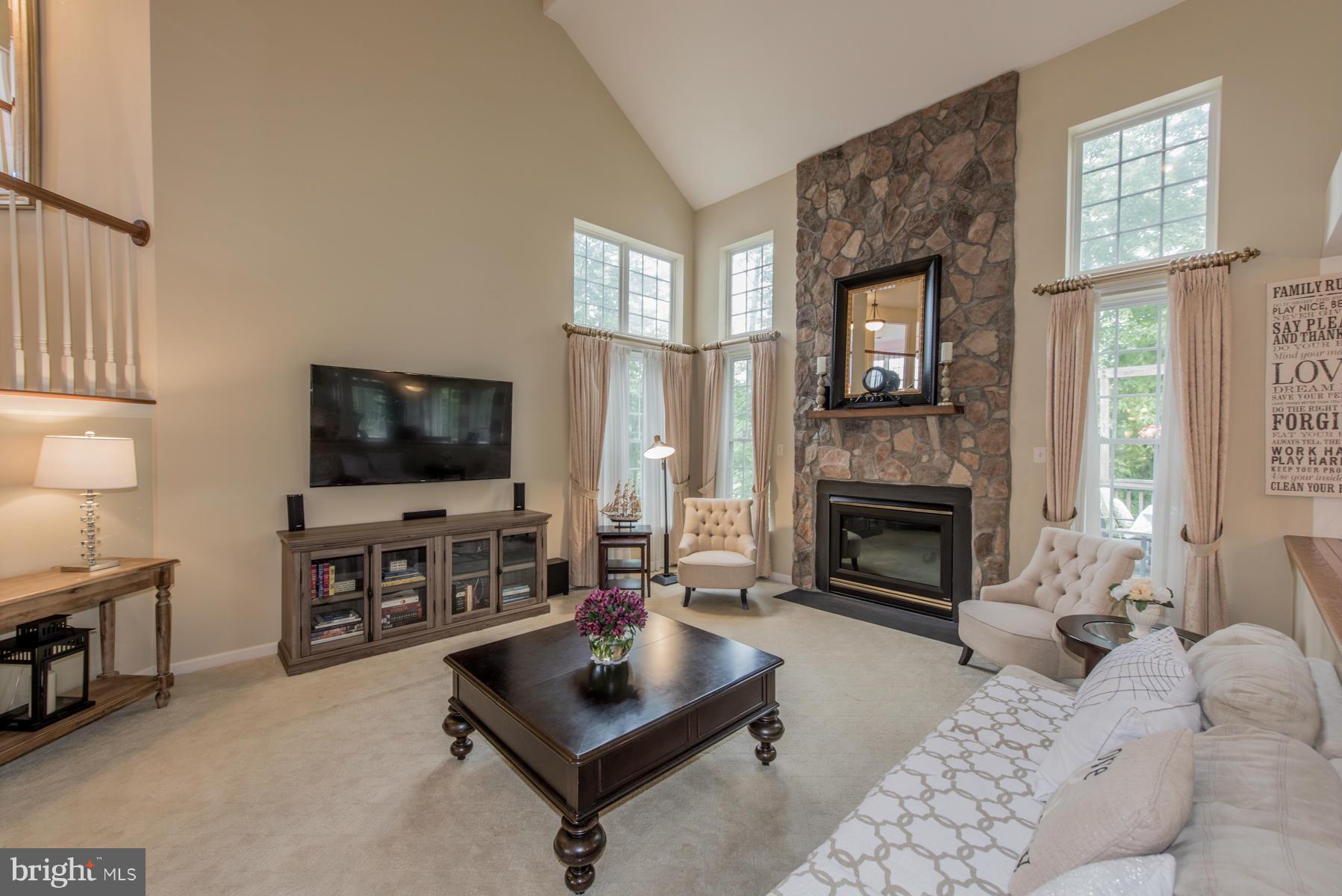 6013 Sandy Ridge Elkridge, MD 21075 - Photo 14 of 30 a living room with furniture and a flat screen tv