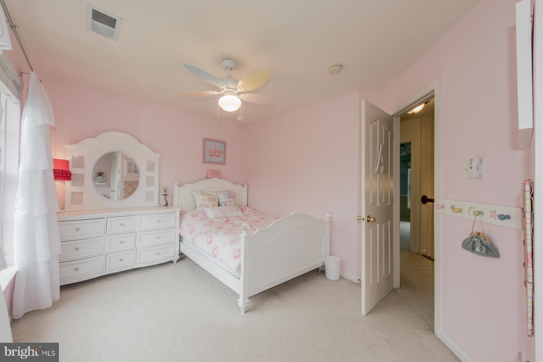 6013 Sandy Ridge Elkridge, MD 21075 - Photo 21 of 30 a room with a bed and a dresser