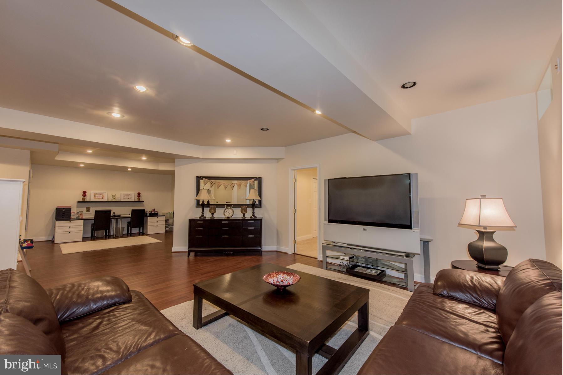 6013 Sandy Ridge Elkridge, MD 21075 - Photo 24 of 30 a living room with furniture and a flat screen tv