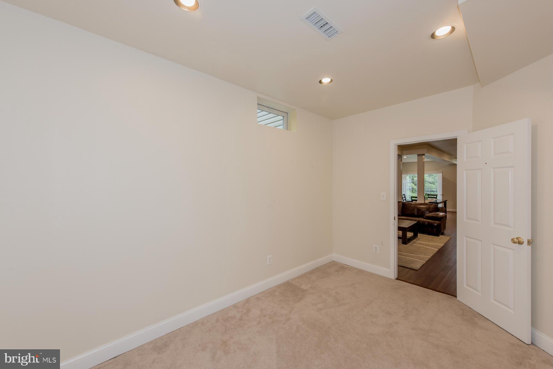 6013 Sandy Ridge Elkridge, MD 21075 - Photo 27 of 30 an empty room with entrance and view of bathroom