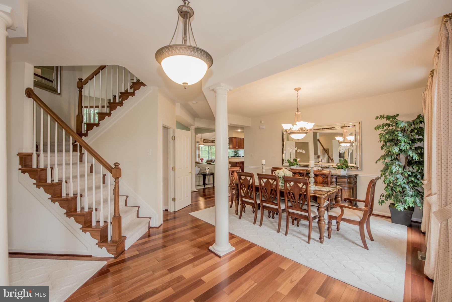 6013 Sandy Ridge Elkridge, MD 21075 - Photo 7 of 30 a view of a dining room with furniture and wooden floor