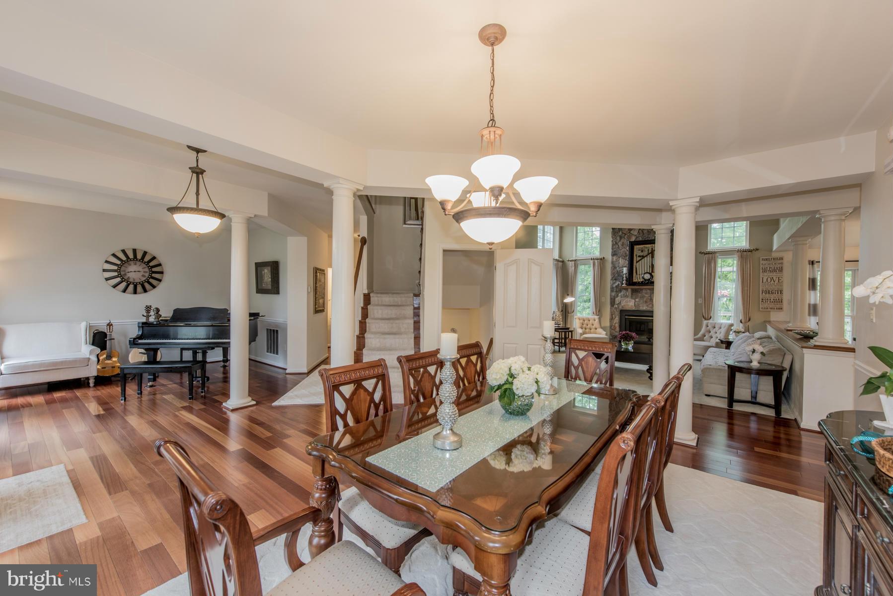 6013 Sandy Ridge Elkridge, MD 21075 - Photo 8 of 30 a view of a dining room with furniture and wooden floor