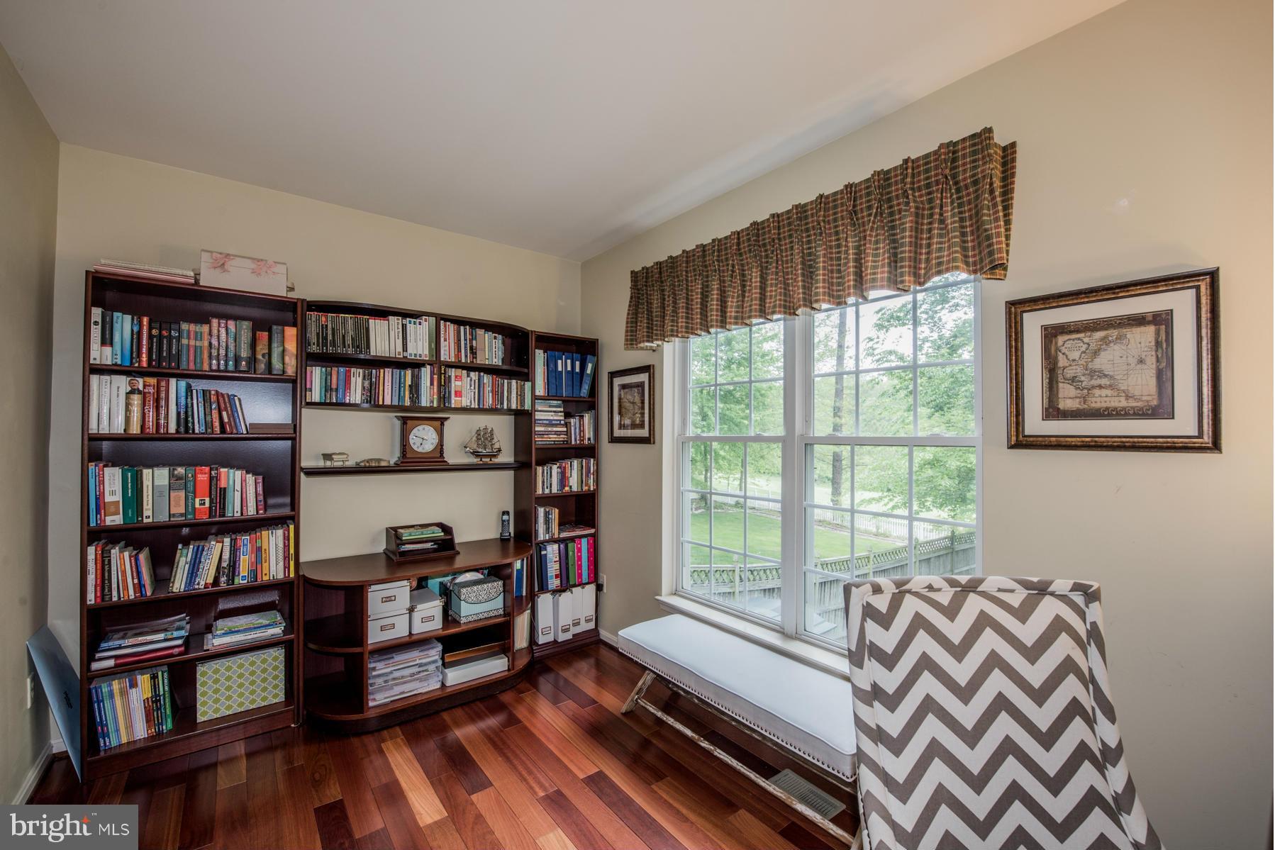 6013 Sandy Ridge Elkridge, MD 21075 - Photo 9 of 30 a bedroom with furniture and a book shelf