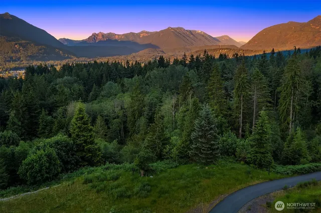a view of a town with mountains in the background