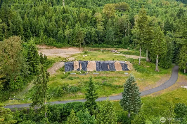 a view of a swimming pool with a yard