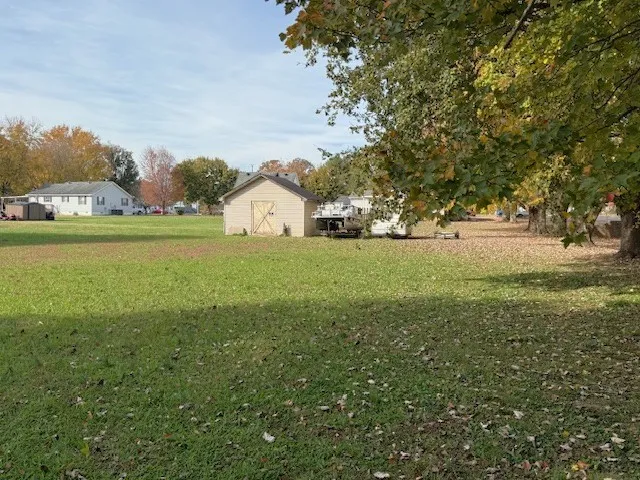 a view of a big yard with and trees