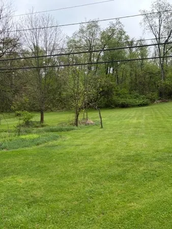 a view of a lake with a yard