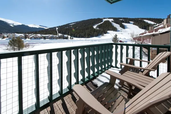 a view of a balcony with wooden floor