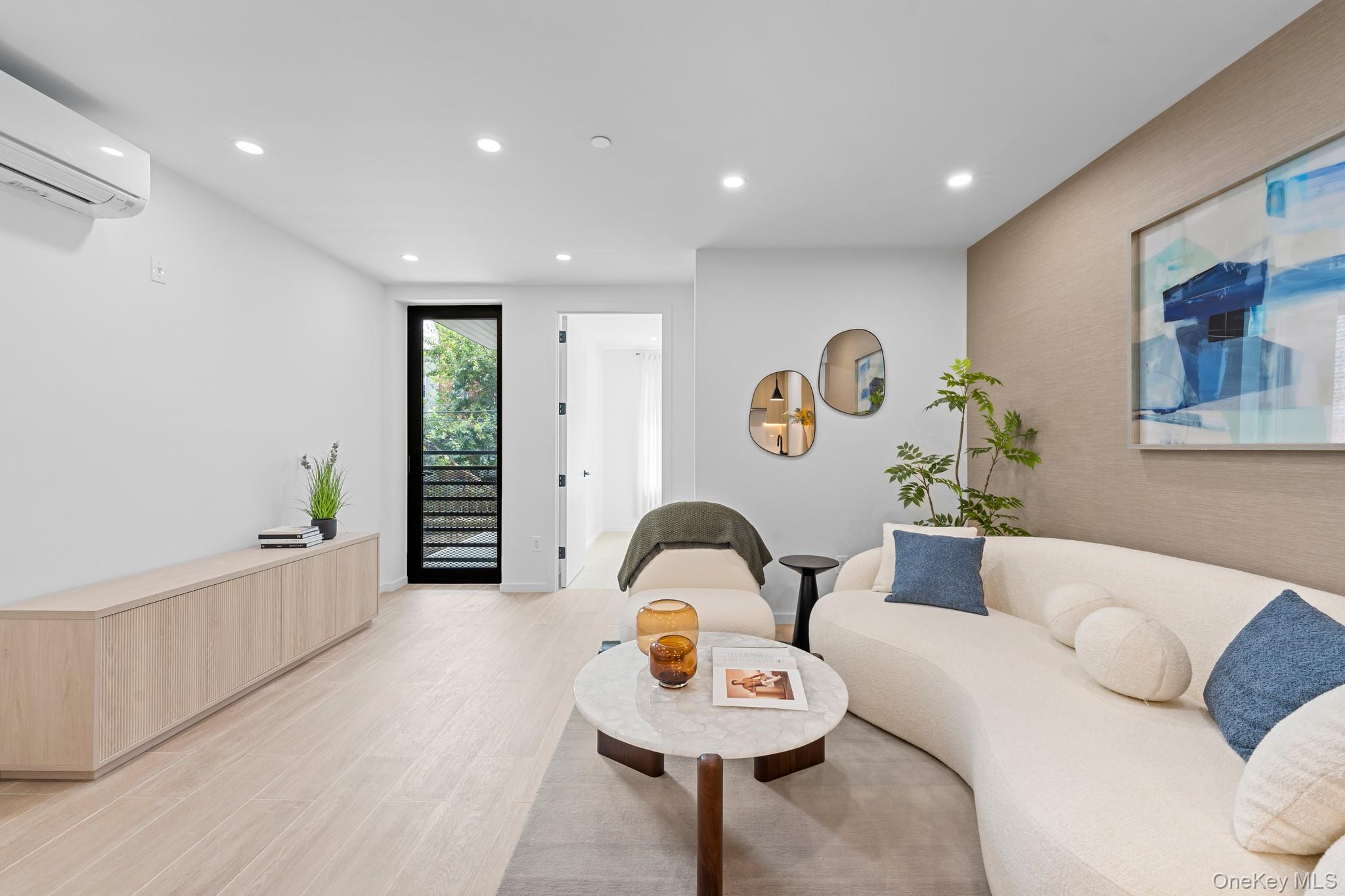 366 Harman Street, Unit 2R Brooklyn, NY 11237 - Photo 14 of 31 Living room featuring recessed lighting, light wood finished floors, and a wall mounted air conditioner