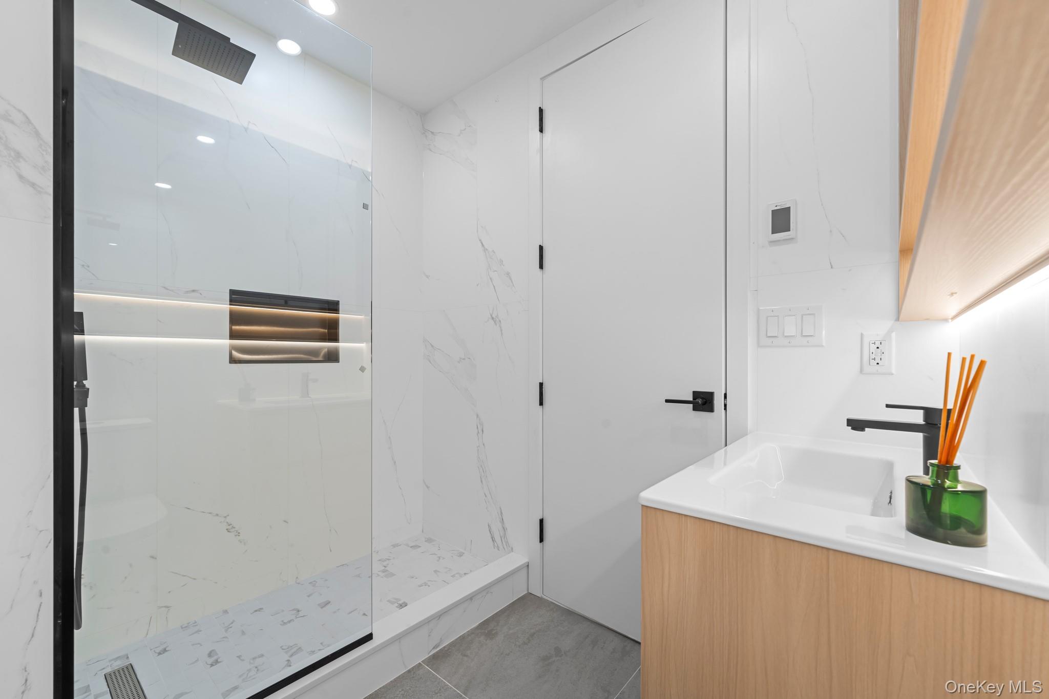 366 Harman Street, Unit 2R Brooklyn, NY 11237 - Photo 24 of 31 Full bathroom with vanity and a marble finish shower