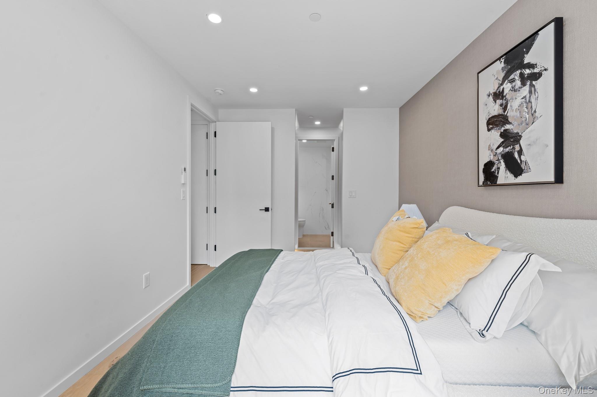 366 Harman Street, Unit 2R Brooklyn, NY 11237 - Photo 27 of 31 Bedroom with recessed lighting, wood finished floors, and connected bathroom