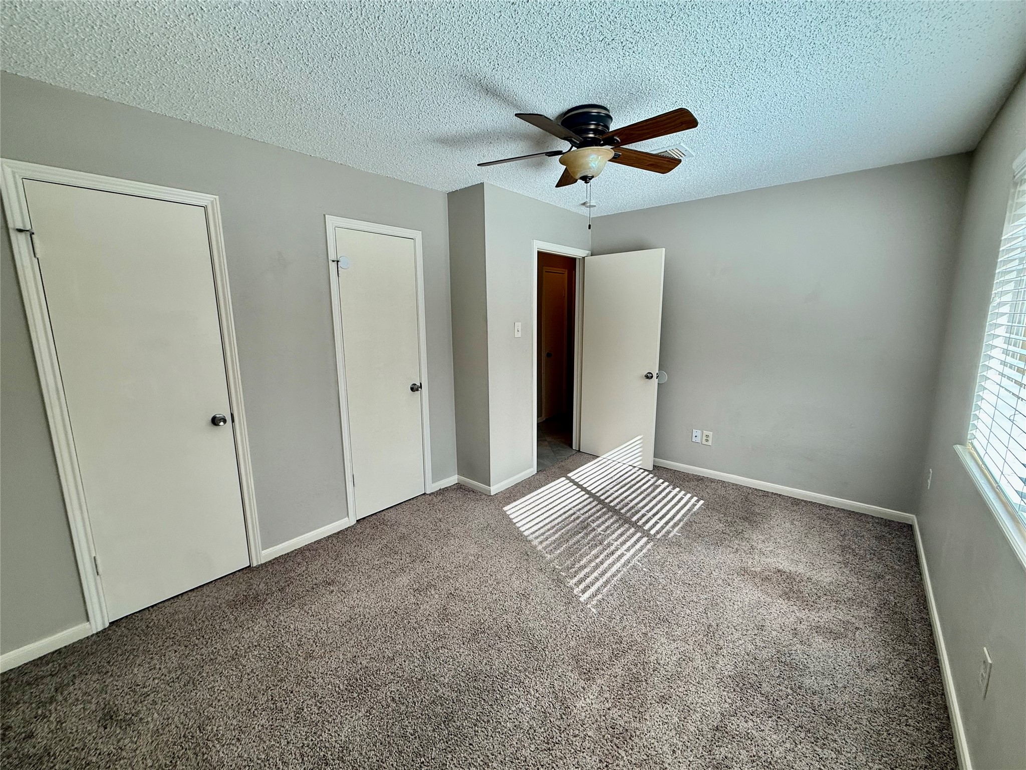 13 Maywind Court The Woodlands, TX 77381 - Photo 23 of 33 This third bedroom has a large window looking out into the back yard.