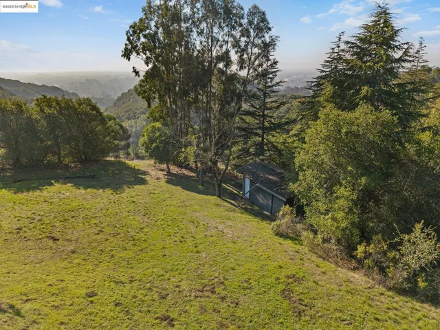 a picture of a glass door with sky view