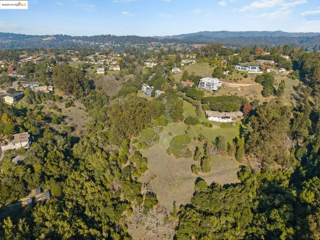 an aerial view of residential building with parking space
