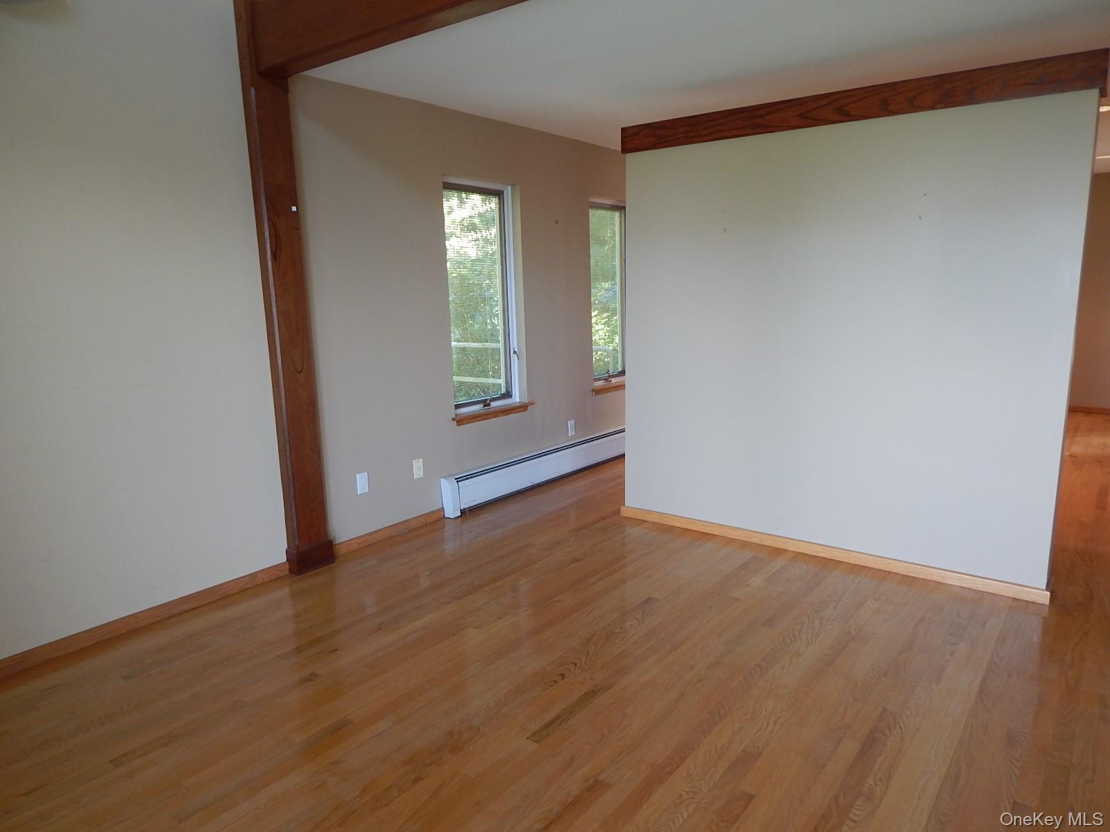 5 Eagle Head Road Cornwall-on-Hudson, NY 12520 - Photo 23 of 24 an empty room with wooden floor and windows