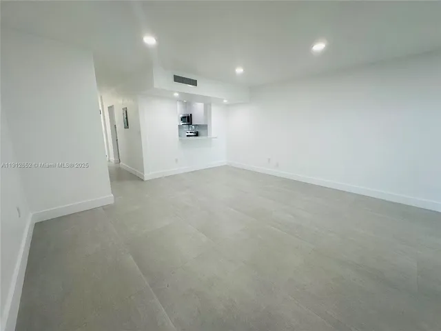 a view of a back yard from a balcony