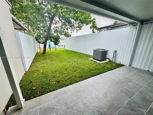 a view of an outdoor space and a yard