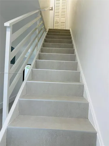 a view of outdoor space with wooden floor and plants