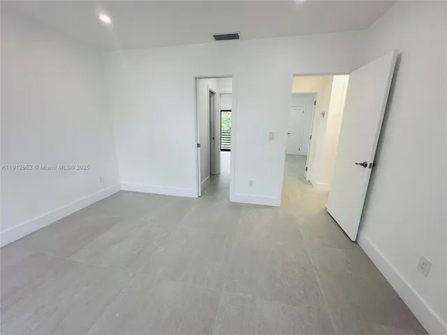 a bathroom with a sink vanity and mirror
