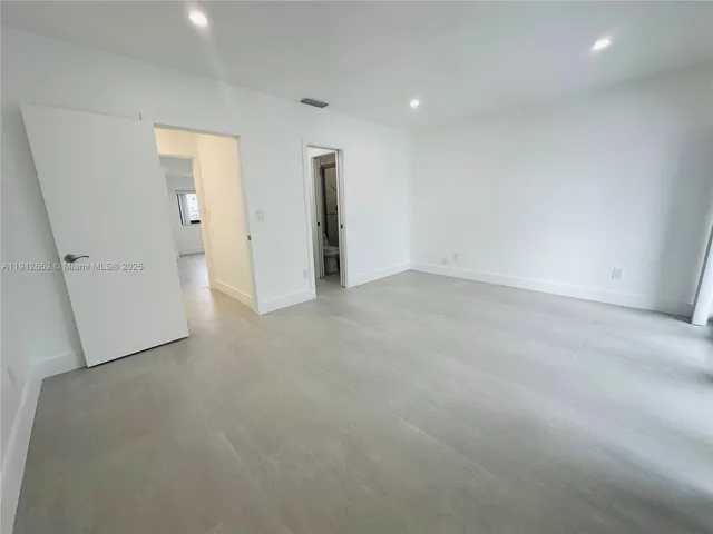 an empty room with a fireplace