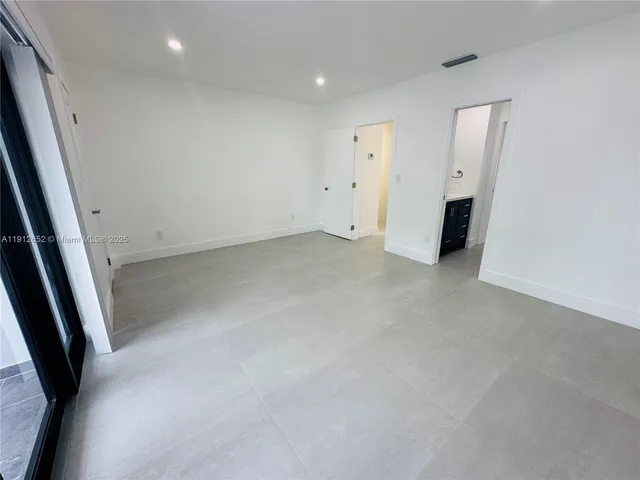 a view of a park with large trees