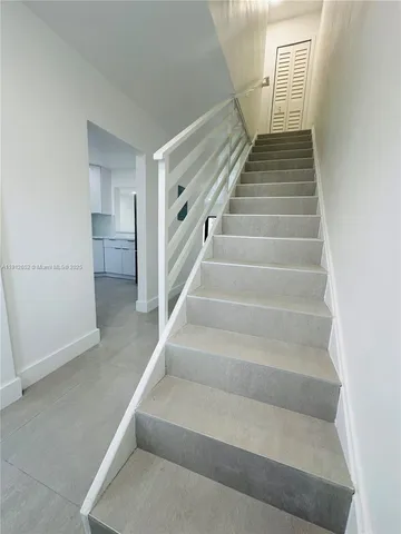 a kitchen with a refrigerator sink and microwave