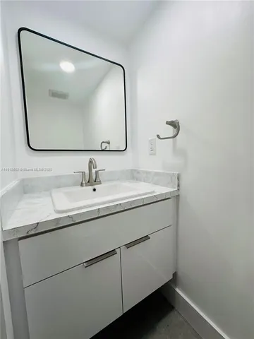 an empty room with a empty space and windows