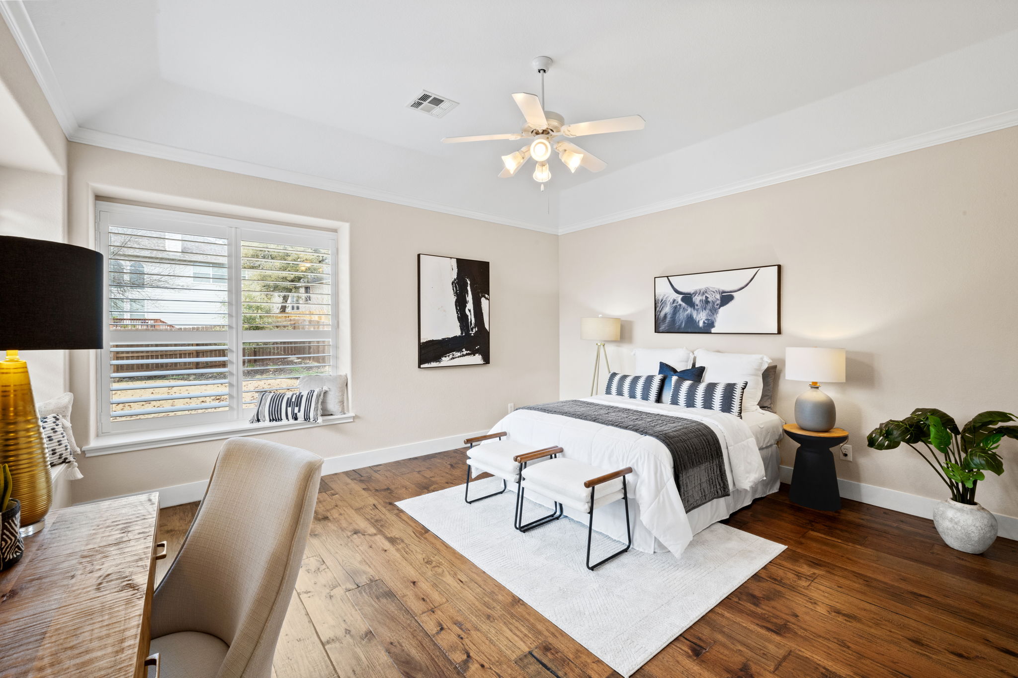 8112 Cobblestone Austin, TX 78735 - Photo 19 of 33 Bedroom featuring a tray ceiling, hardwood / wood-style flooring, crown molding, and ceiling fan