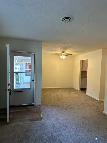 an empty room with a empty space and windows