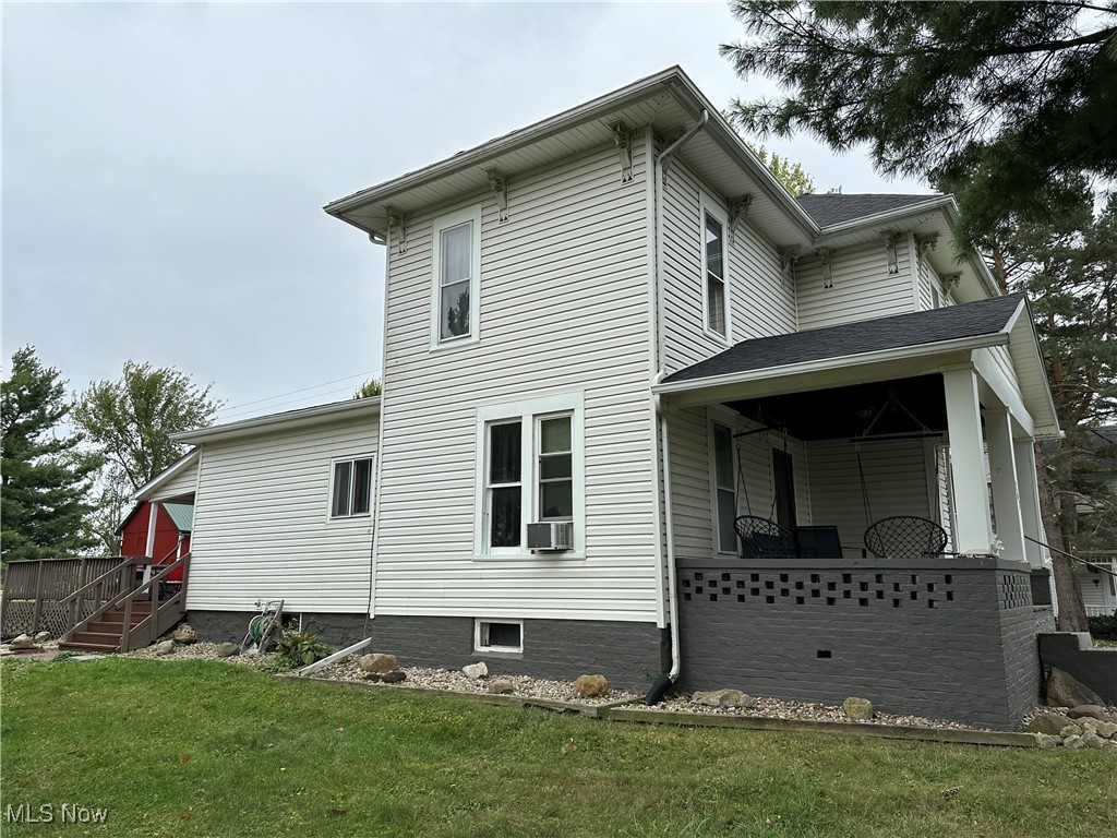 267 State Rte 511 Nova, OH 44859 - Photo 2 of 20 Back of property featuring a lawn and cooling unit