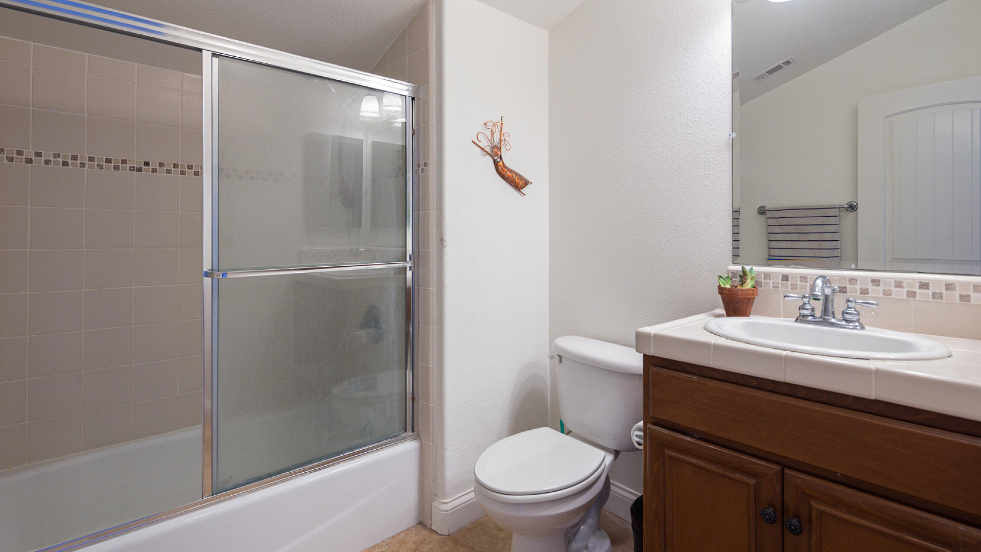 3709 Jupiter Avenue Lompoc, CA 93436 - Photo 15 of 27 a bathroom with a sink toilet and shower