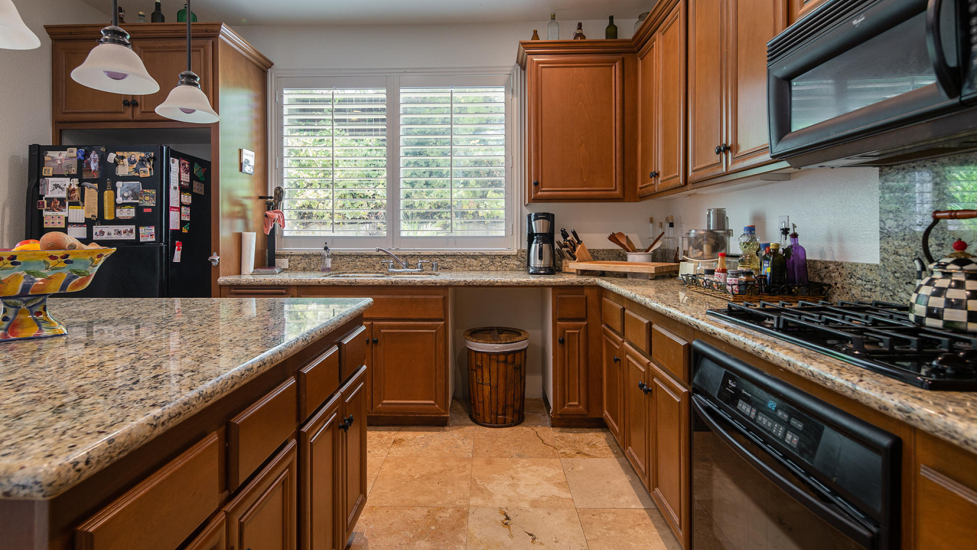 3709 Jupiter Avenue Lompoc, CA 93436 - Photo 6 of 27 a kitchen with stainless steel appliances granite countertop a sink a stove and a wooden cabinets