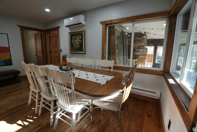 3711 North Canyon Road Provo, UT 84604 - Photo 4 of 42 Dining room with dark wood-style flooring, a wall mounted air conditioner, baseboard heating, and recessed lighting