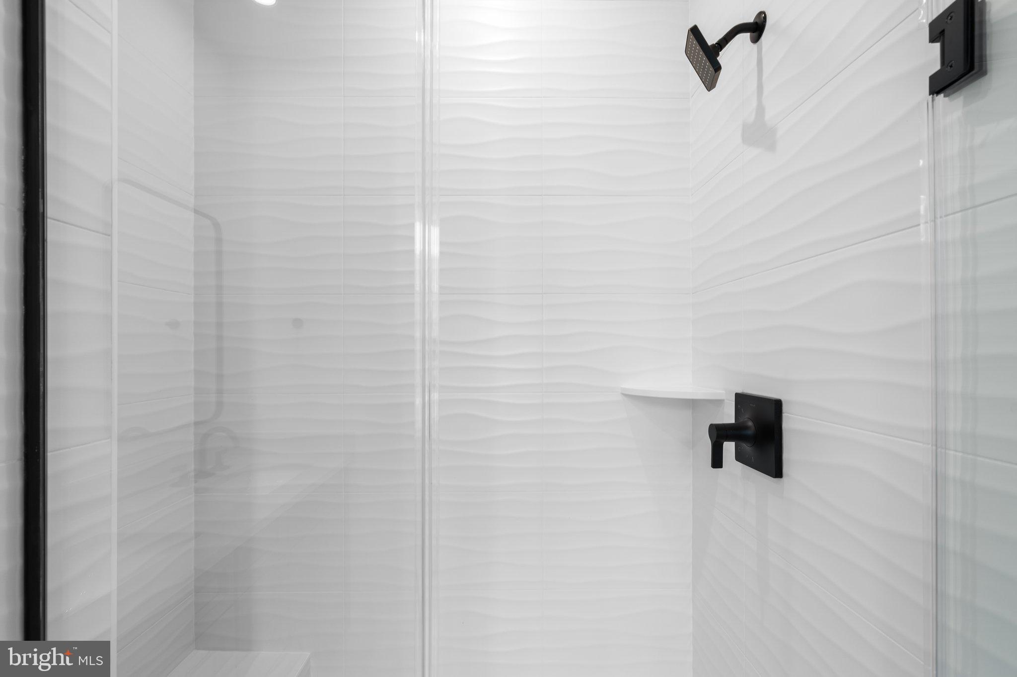 23079 Copper Tree Terrace Ashburn, VA 20148 - Photo 32 of 49 a bathroom with a shower