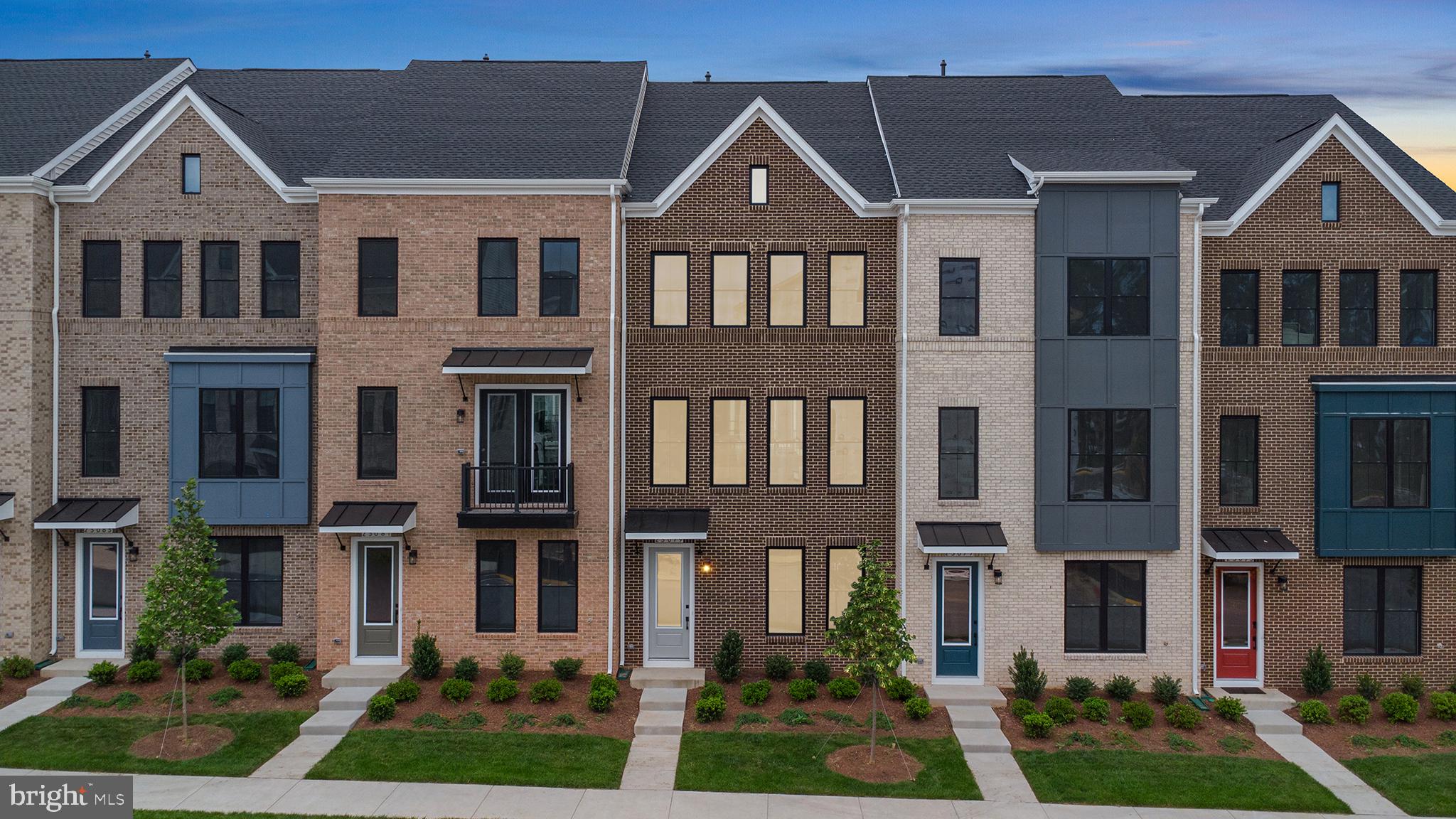 23079 Copper Tree Terrace Ashburn, VA 20148 - Photo 33 of 49 front view of residential houses with a yard